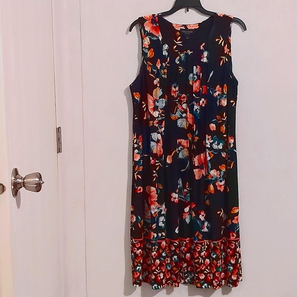 Short Sleeve dress with pleats on front and back of the dress.